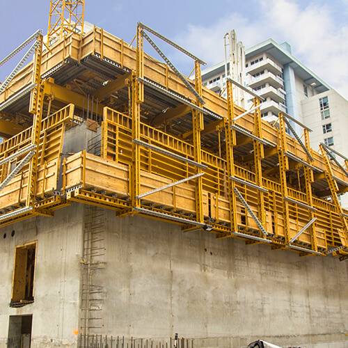construction happening on a large concrete tower